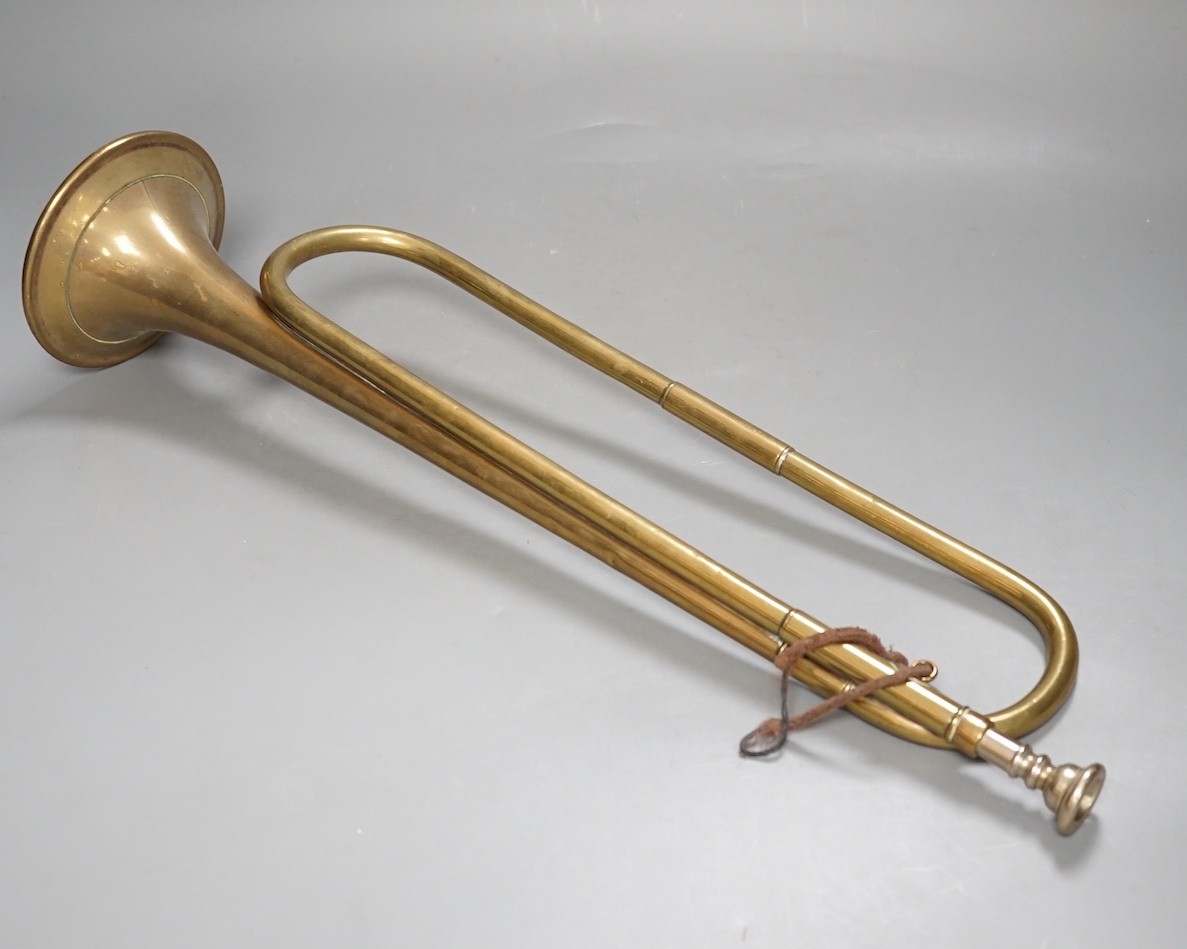 A Premier brass bugle, 51 cms long.